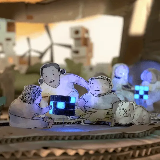 A hand-drawn animated scene of children and a dog gathered around a glowing device, with wind turbines in the background.