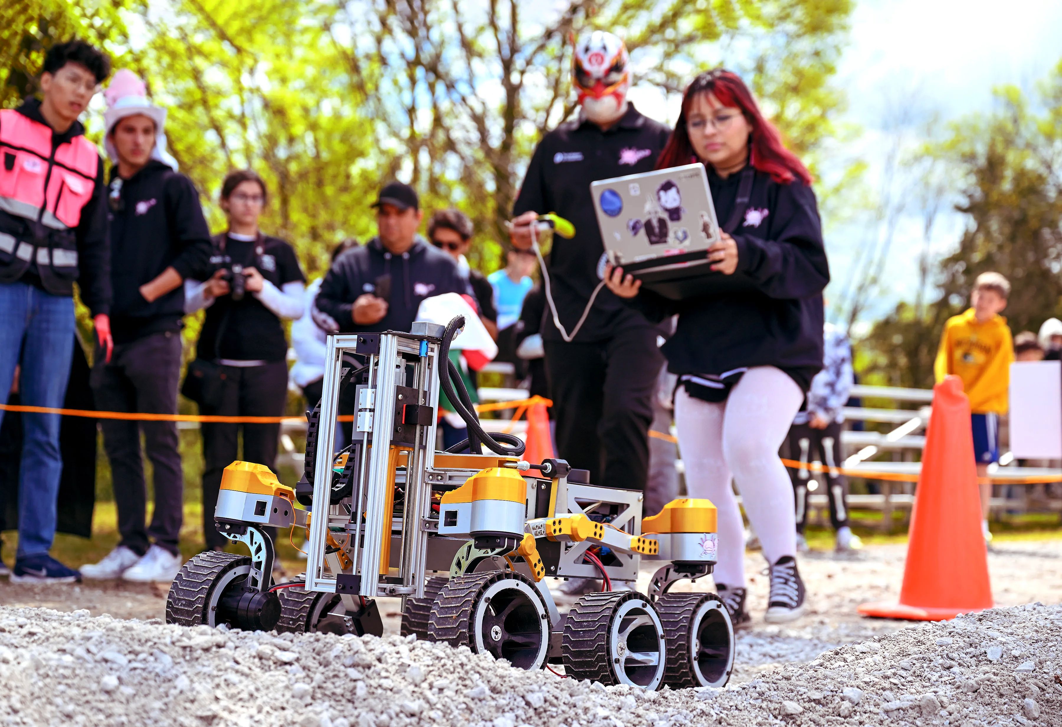 Student teams at NASA's Human Exploration Rover Challenge manually steer rovers while incorporating tool AI into the design process